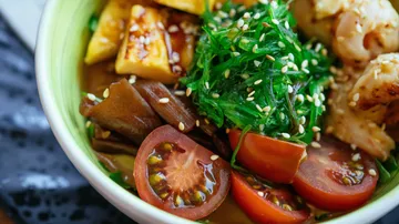 Bowl with colorful salad, fresh ingredients and vegetables.
