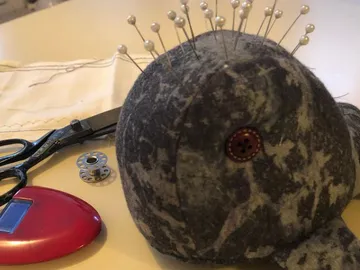 Pattern pendant with pins on a table