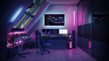 Modern workstation with monitors in a futuristic space.
