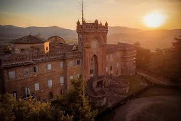 An old castle stands majestically at sunset.