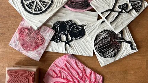 Stamps with various fruit motifs are scattered.