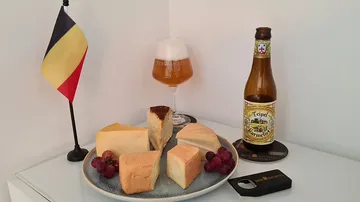 Plate with cheese, beer and Belgian flag. Relaxed ambiance.