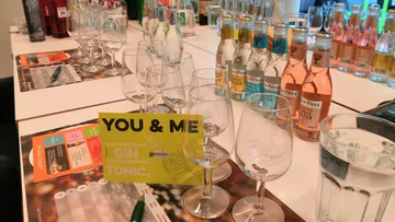 Glasses and bottles on the table, try gin and tonic.