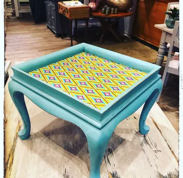 Colourful table with pattern in an inviting space.