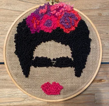 Black-frozen hairstyle with colorful flowers on fabric.
