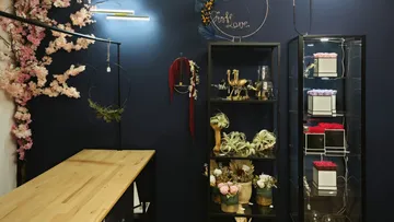 A shop with floral arrangements and decorative objects.