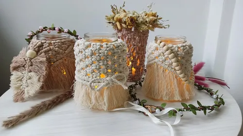 Three decorated glasses stand on a table and light up.