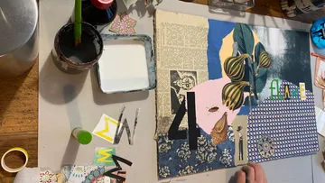 Artwork: Paper collage is created on a table.