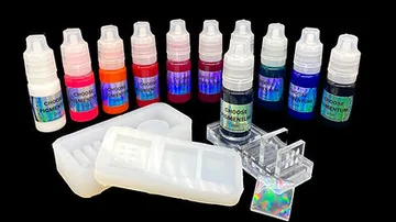 Colourful drops of paint with containers and molded silicone.