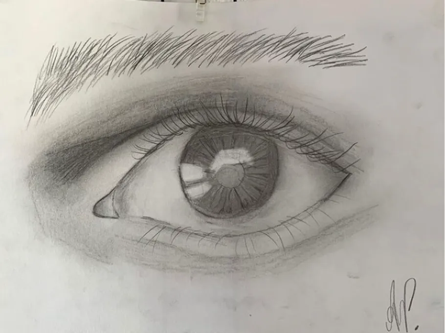 Eye drawing with detailed iris and eyelashes on paper.