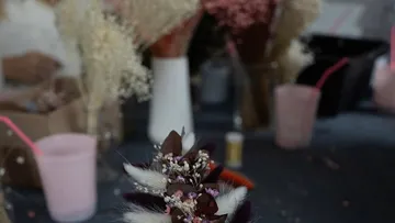 Dried flowers are arranged in a creative space.