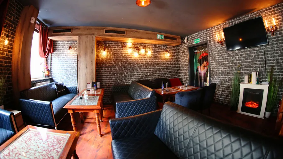 Lounge with comfortable seating and soft lighting.