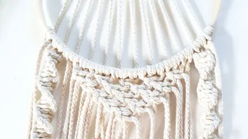 Macrame wall hanging decoratively on a wall