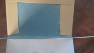 Blue paper visible inside a folded box.