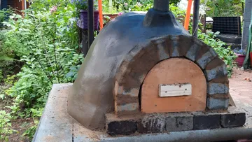 Stone oven, ready to heat in the garden.