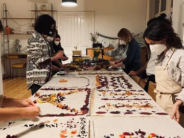 Table with people making edible decorations