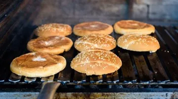 Brown bunse on a grill in a cool room.
