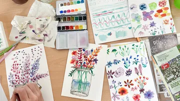 Watercolors are used to paint pictures of flowers.