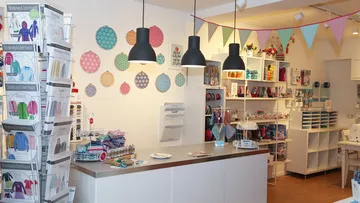 Craft shop with sewing supplies and colorful decorations.