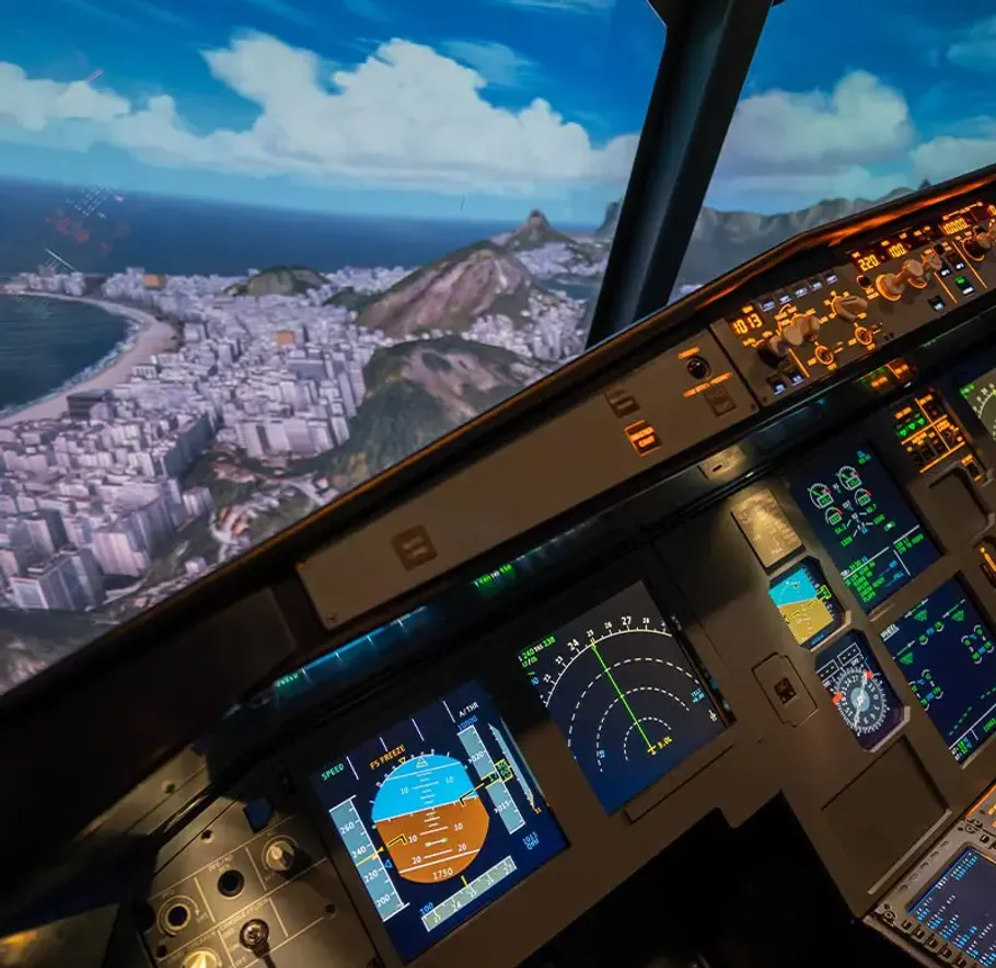 Cockpit eines Flugzeugs mit Instrumenten und Landschaftsansicht.