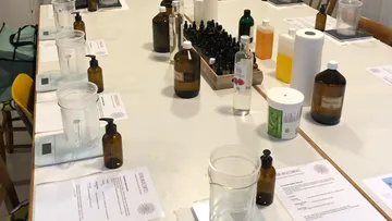 Tables with bottles and tools for an experiment.