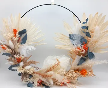 Circular wreath with dried plants and flowers