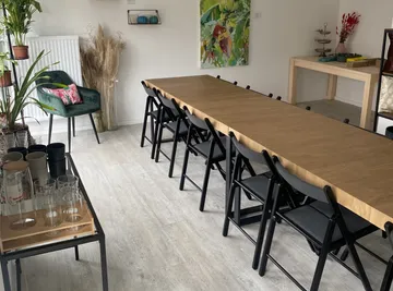 Dining table with chairs in modern room.