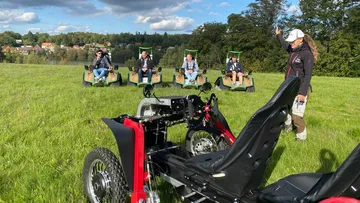 The vehicle is parked while the group asks questions.