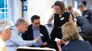 Group discussion: People discuss concentrated in one room.