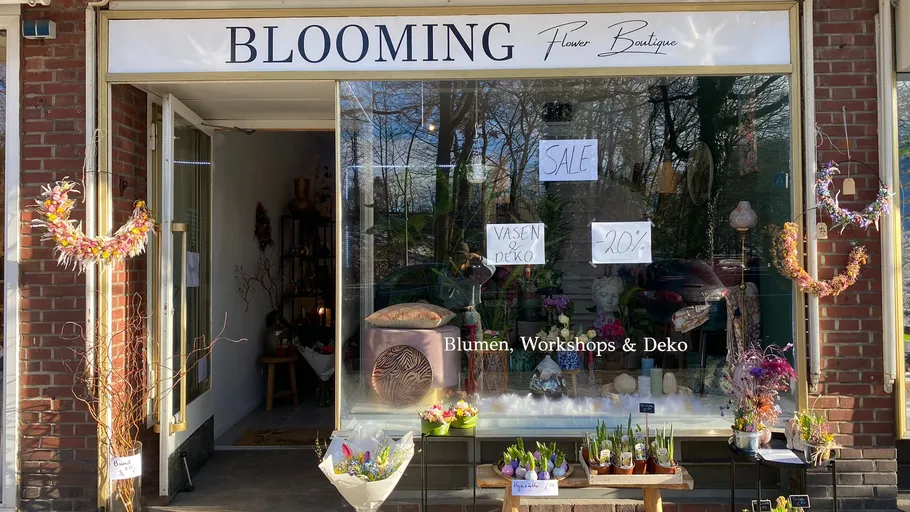 Flower shop with discount offers and colorful flower arrangements.