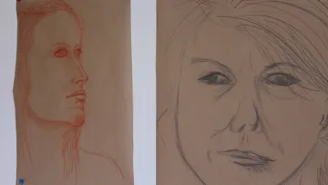 Two portraits of women, one on the side, the other on the front.