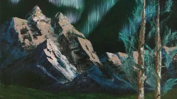 Felsen stehen majestätisch unter schimmernden Nordlichtern.