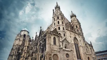 The cathedral stands majestically under cloudy skies.