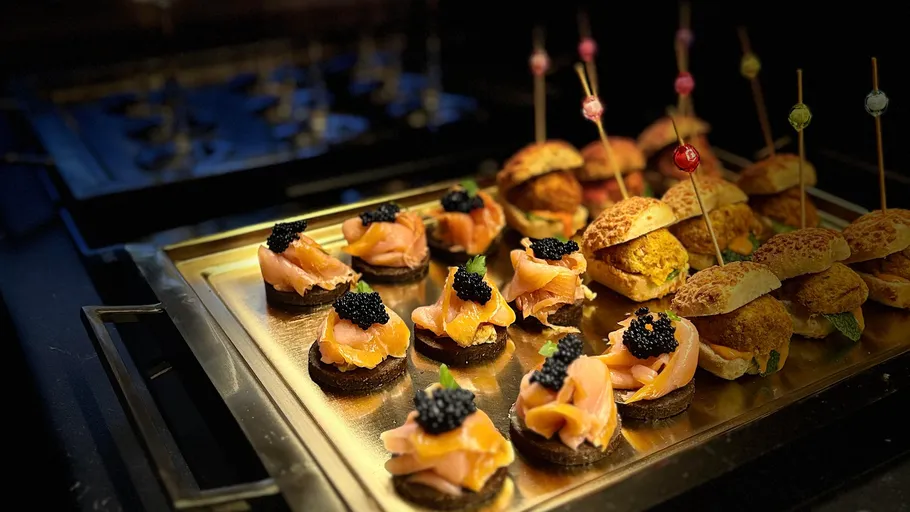 Gourmet appetizers on a tray, decorated and served