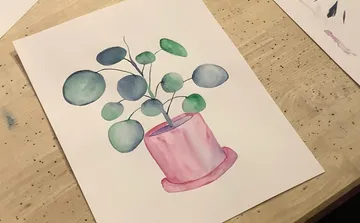 Watercolor painting of plant in pink pot, table setting.