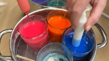 Paints are filled into glasses to fulfill creative purposes.