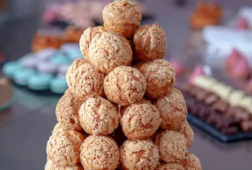 A cake made from filled dough balls is on a table.