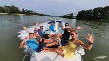 A group of people is relaxing on a boat.