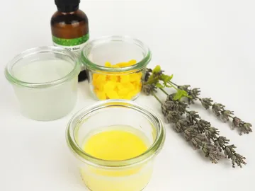 Small glasses with ingredients and lavender next to them.