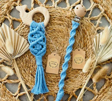 Wooden toys and woven accessories on a natural surface.