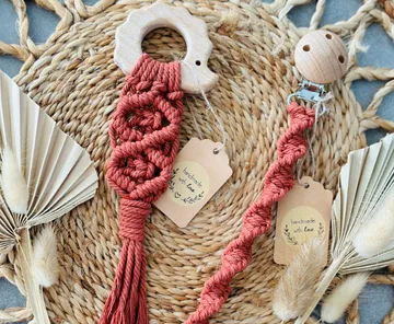 Handmade accessories lie on a natural surface.