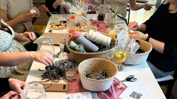Baskets with yarn, people make crafts in good company.