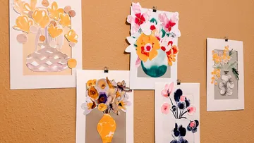 Five pictures of flower vases hang on a wall.