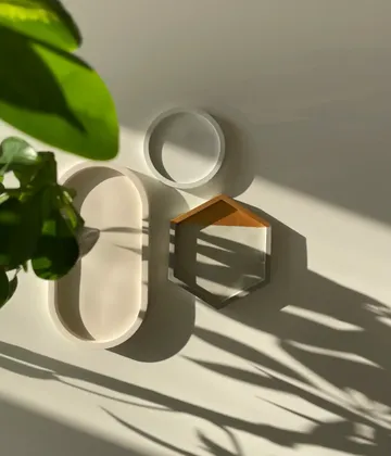 Walls depict geometric objects surrounded by plants.