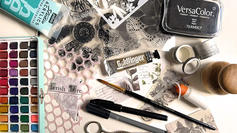 Crafting materials are scattered on a table.