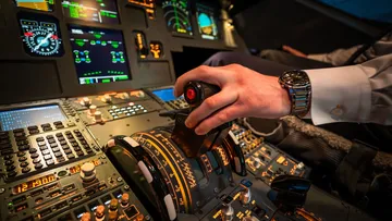 Hand controls joysticks in the cockpit of an airplane.