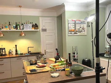 Kitchen with cooking utensils, preparing for an event.