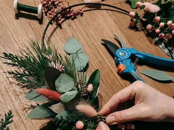 Flowers are arranged to create a decorative wreath.
