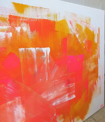 Colourful layers of paint on canvas, dynamic and abstract.