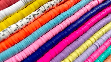 Colourful, round rings are stacked on top of each other.